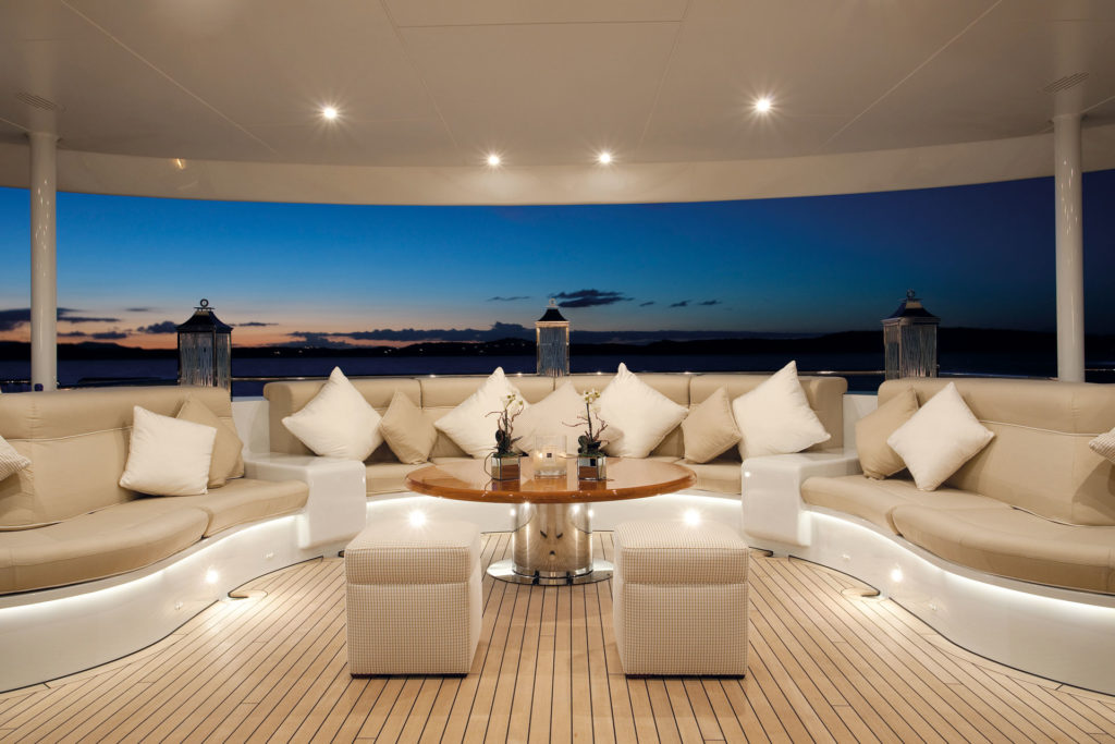 A wraparound cream sofa on a yacht