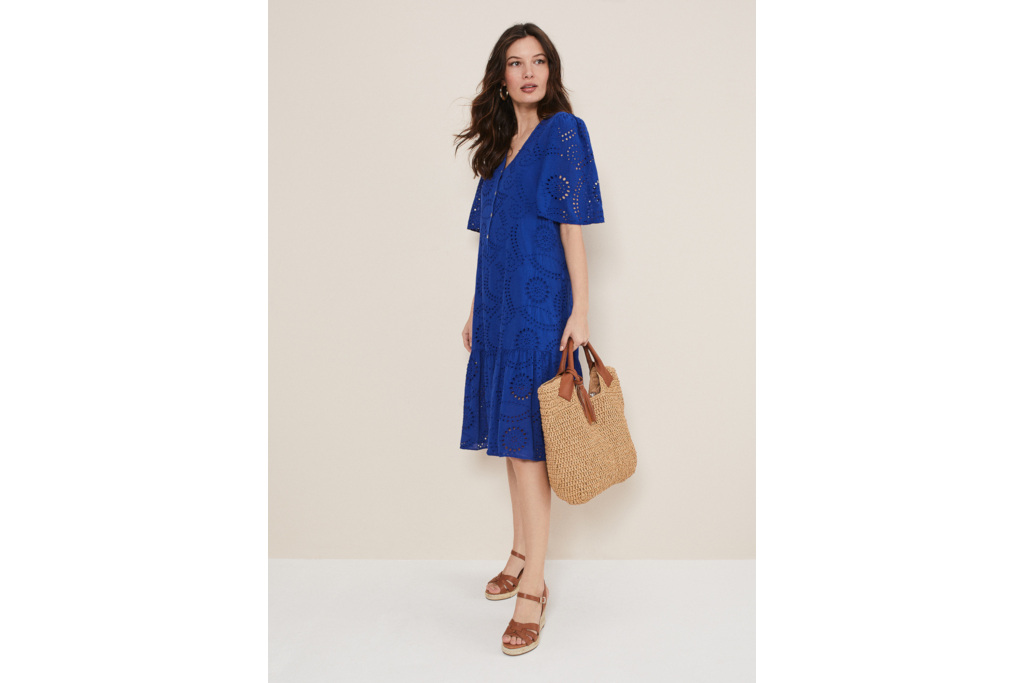 Woman in blue midi dress