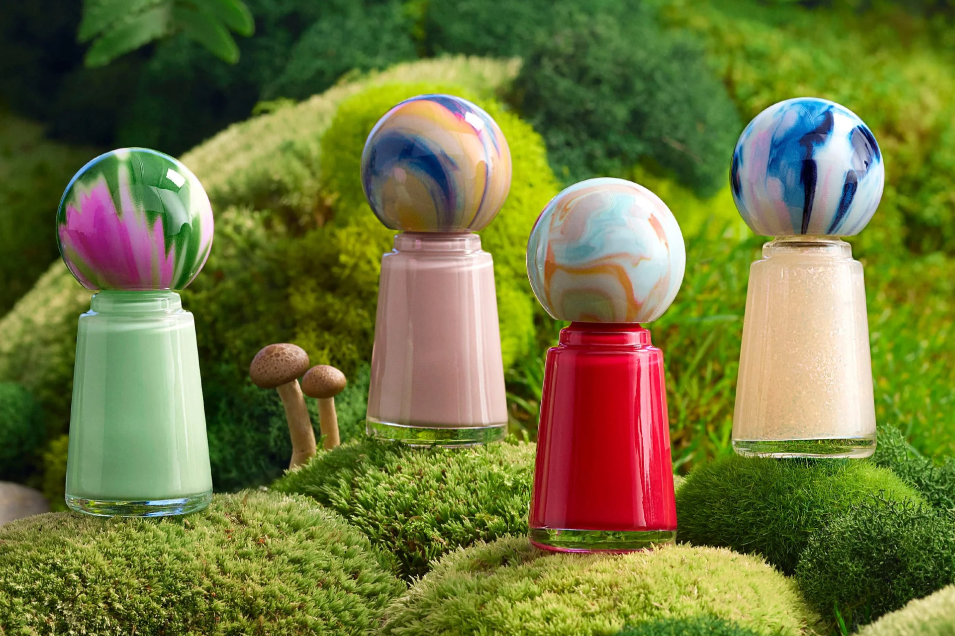 Colourful nail varnish bottles on moss background
