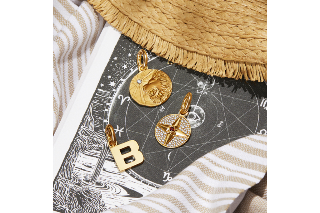 Gold charms on black and white print