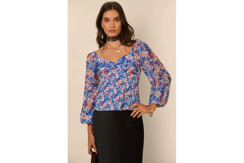 Woman in blue floral top