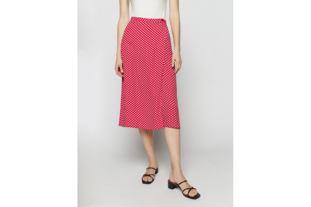 Woman in red skirt with white dots