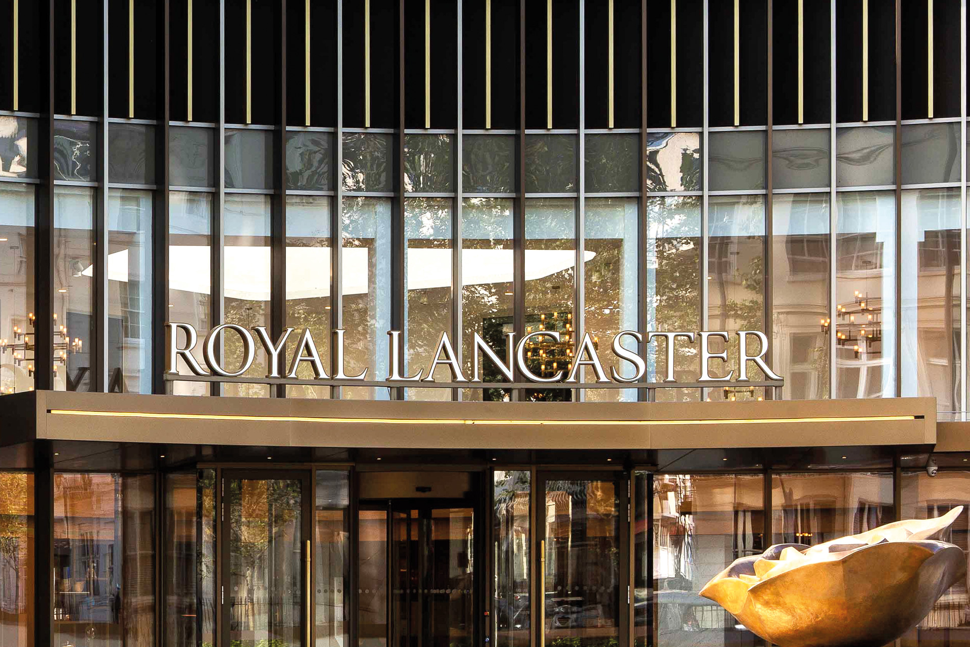 Glass and gold exterior of Royal Lancaster London.