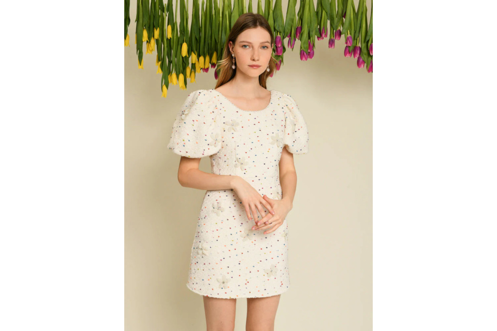 Woman in cream mini dress