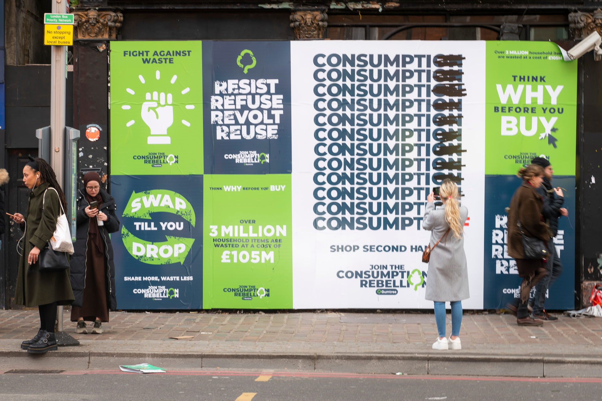 Posters on board on street in London