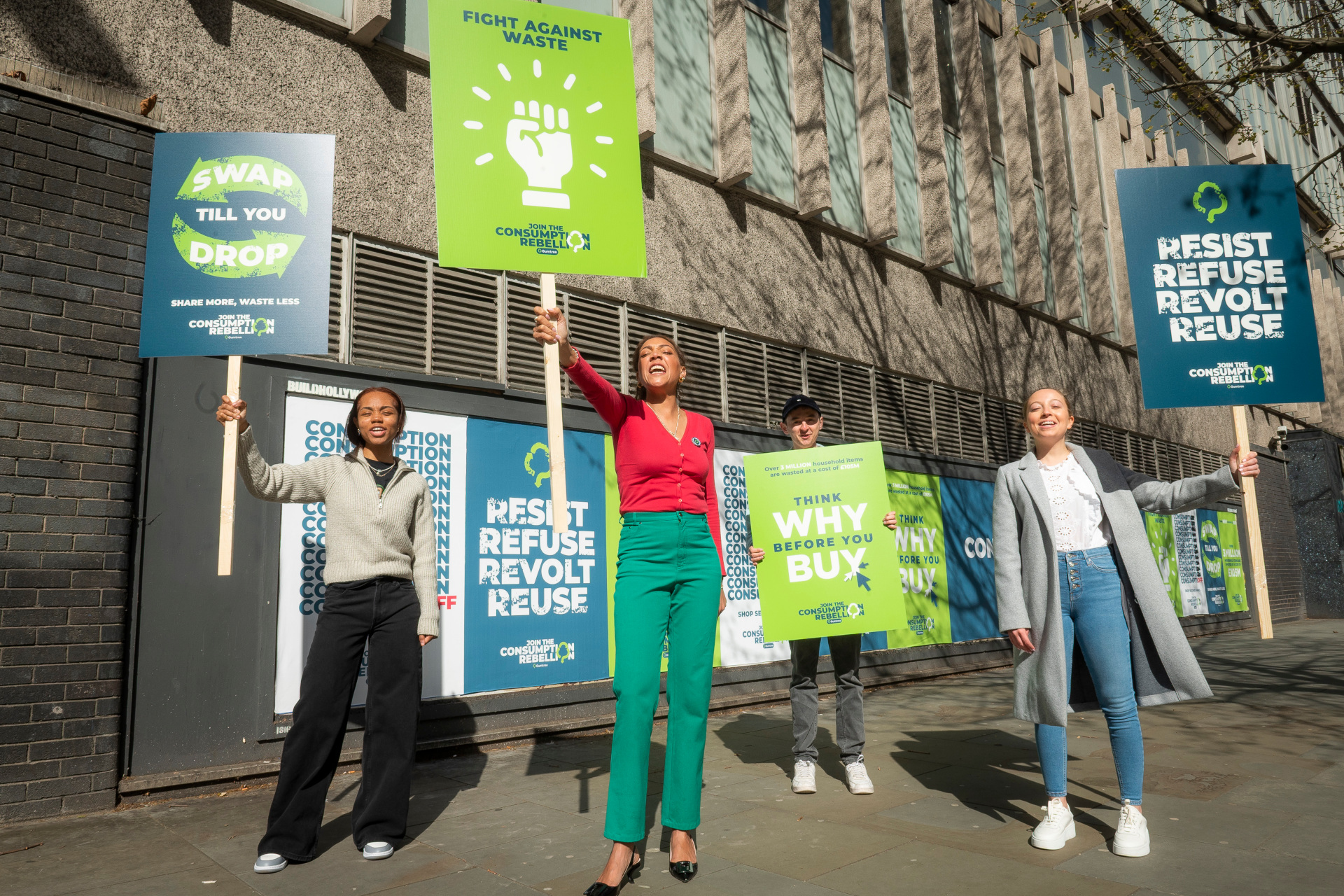 Miquita Oliver and other people stood with pickets for Earth Day 2023