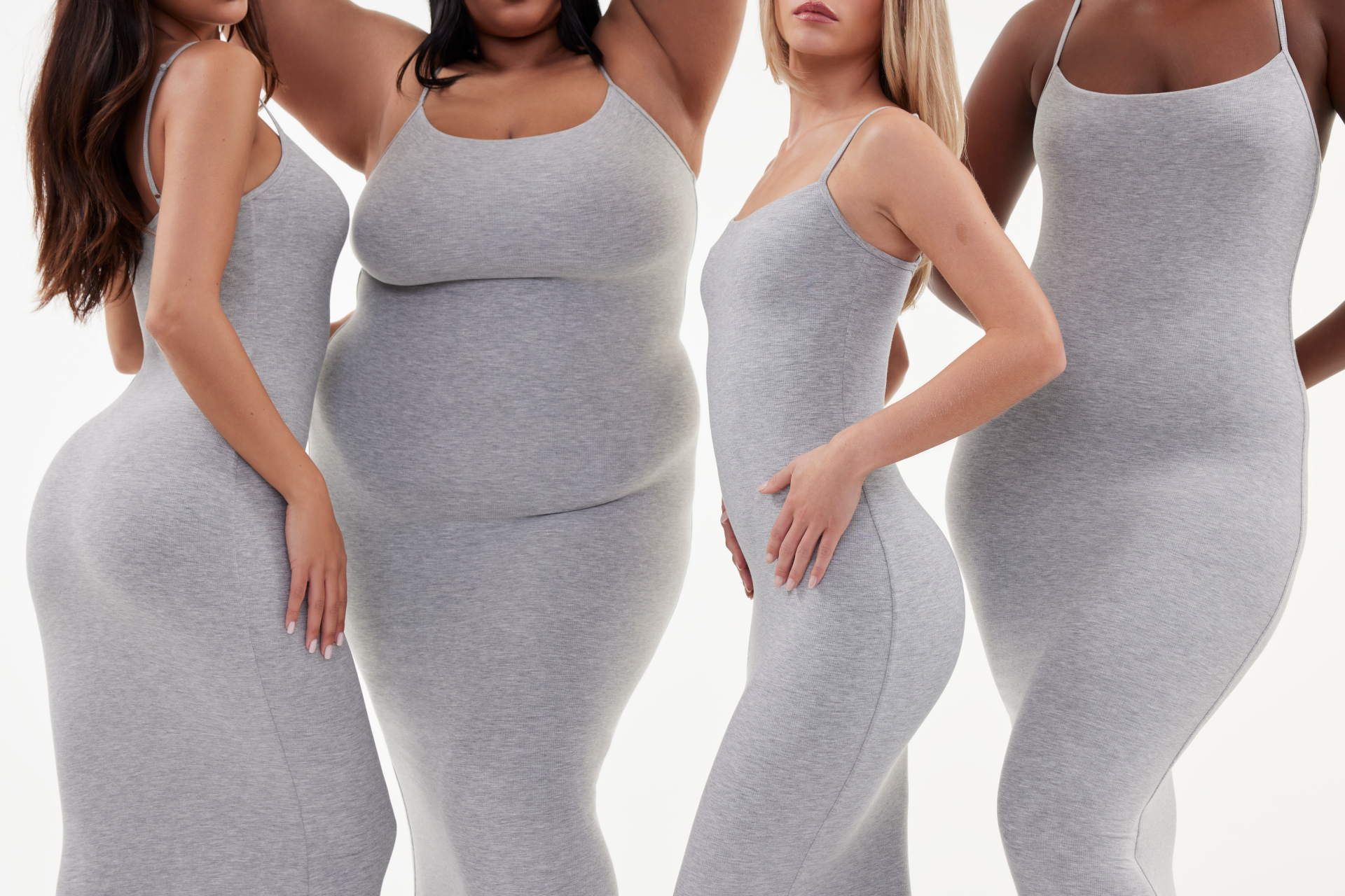 Four women in grey bodycon dresses