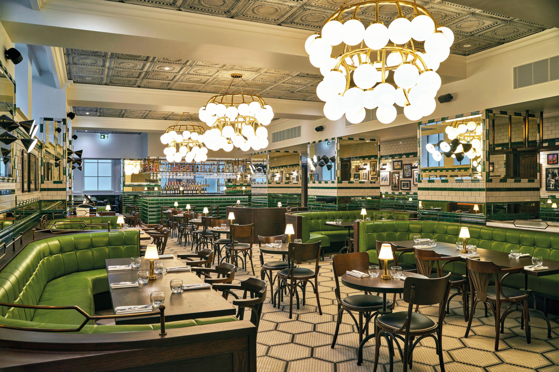 Dining room with green velvet seats and booths