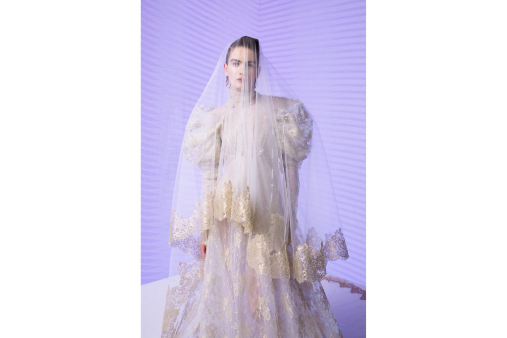 Woman in white dress and veil