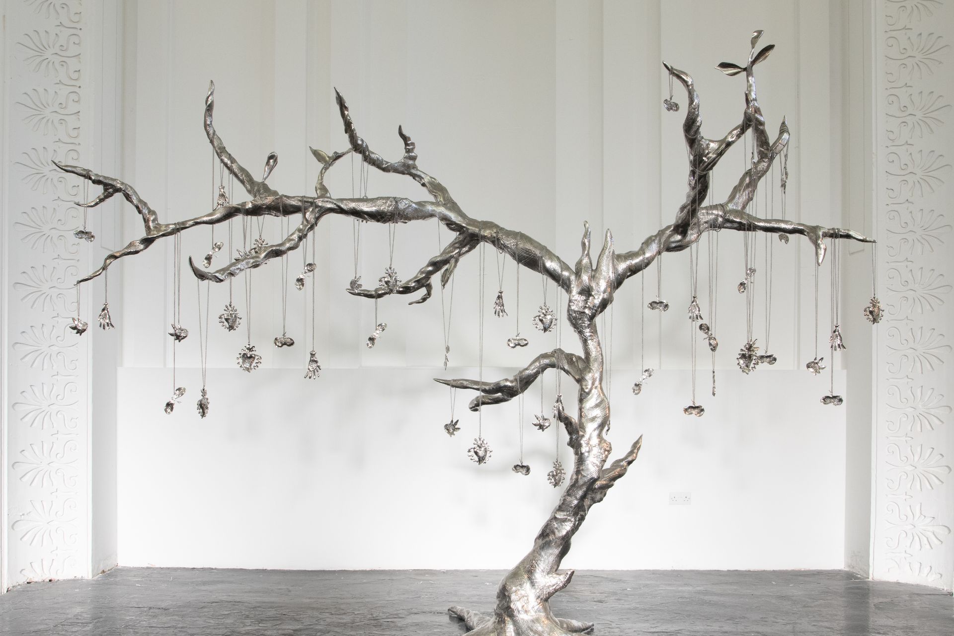 Stainless steel tree sculpture with metal hanging ornaments