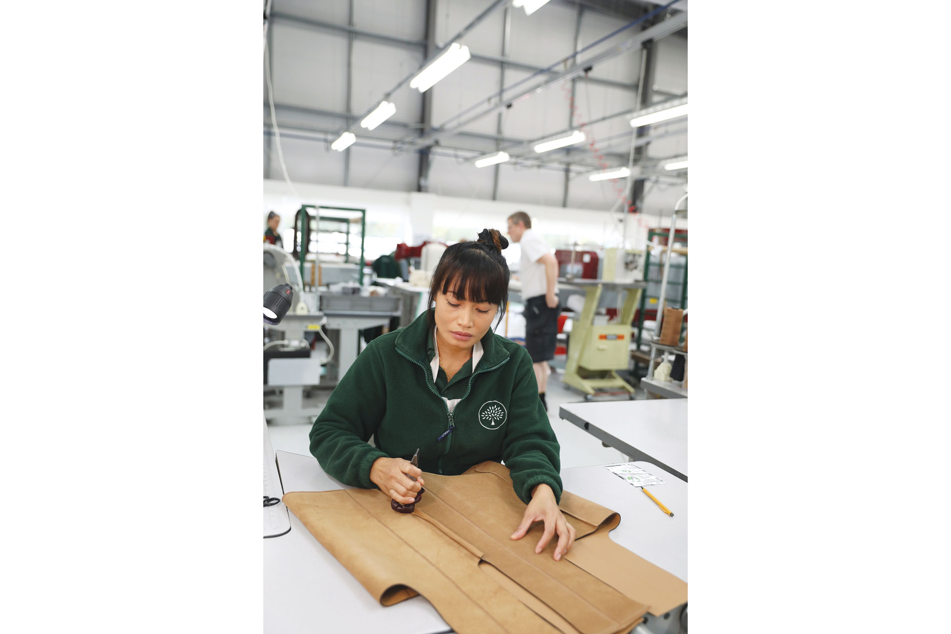 Woman working in the Mulberry factory