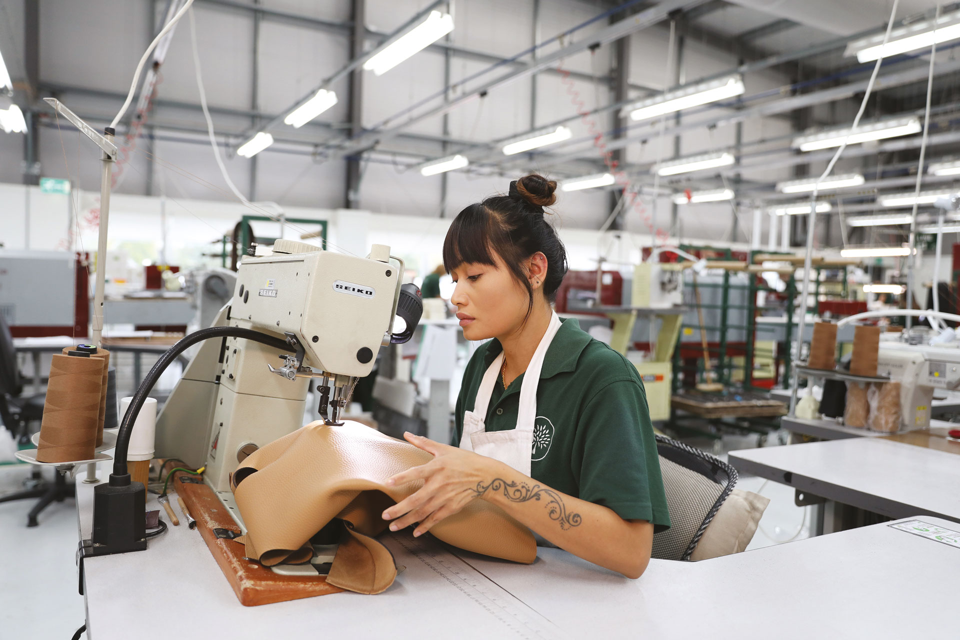 Woman working in the Mulberry factory