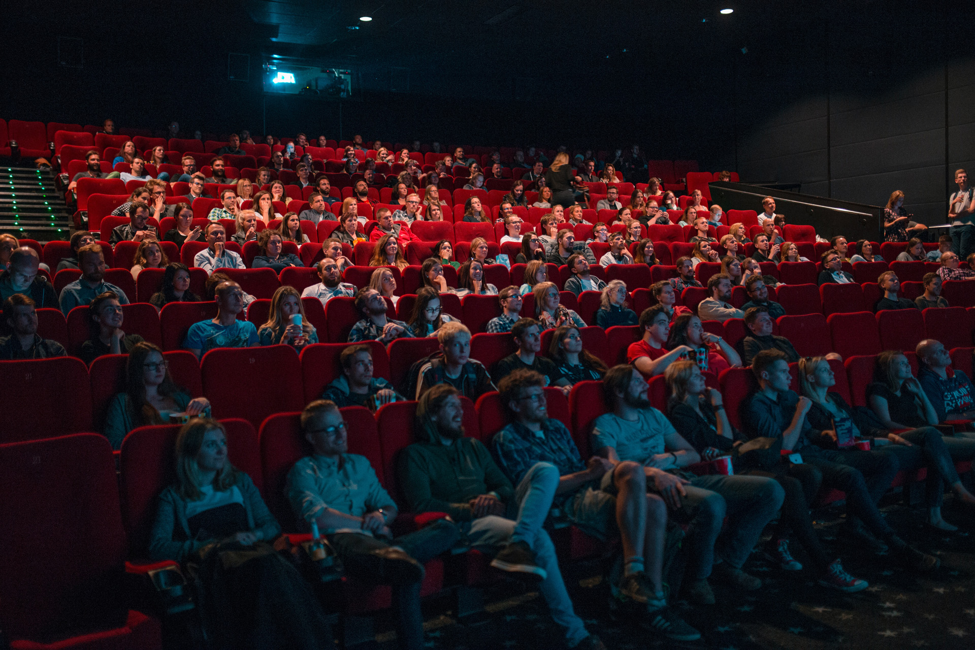 A crowd watching a film in a cinema