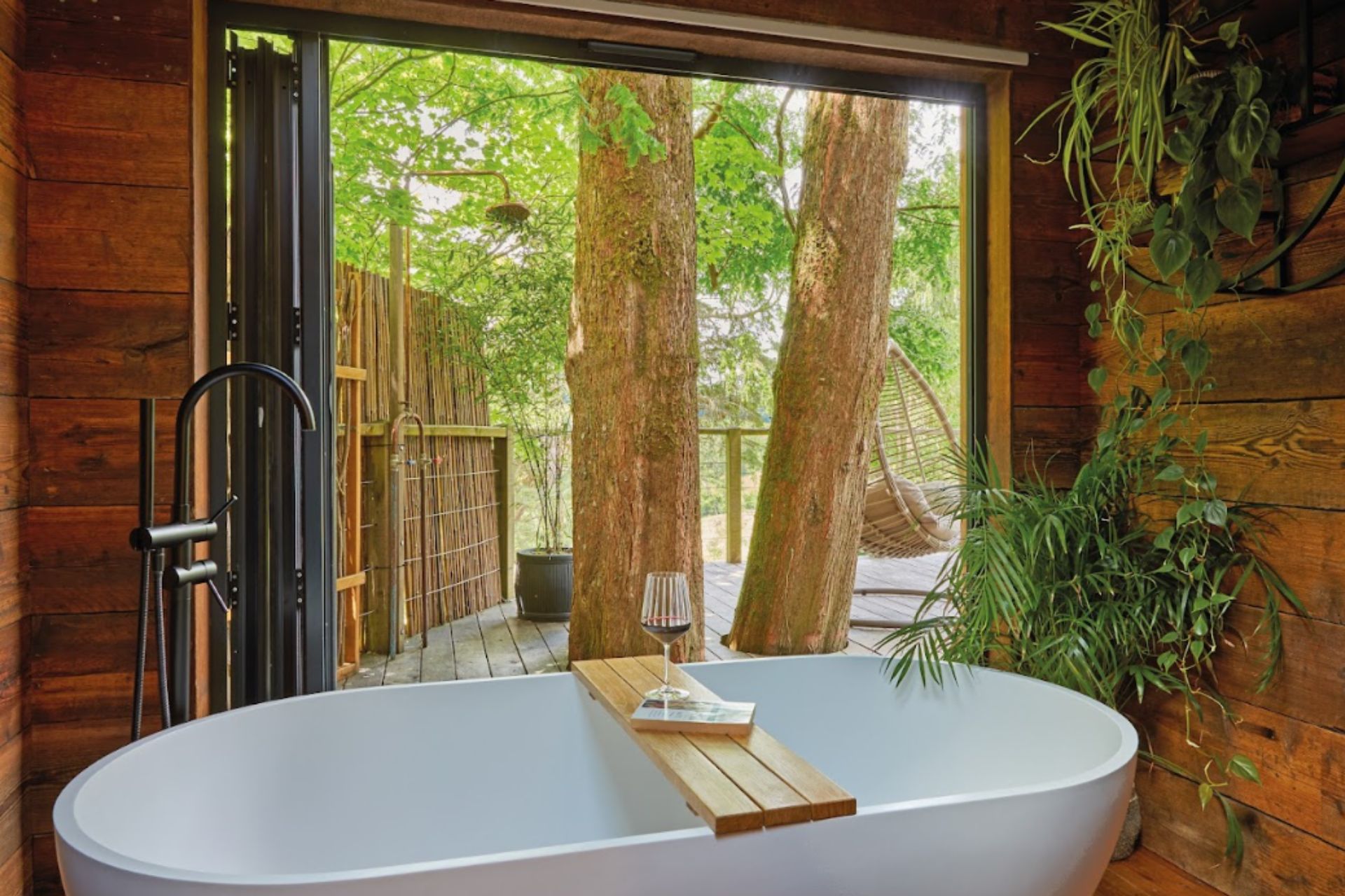 Treehouse bathroom with forest views.