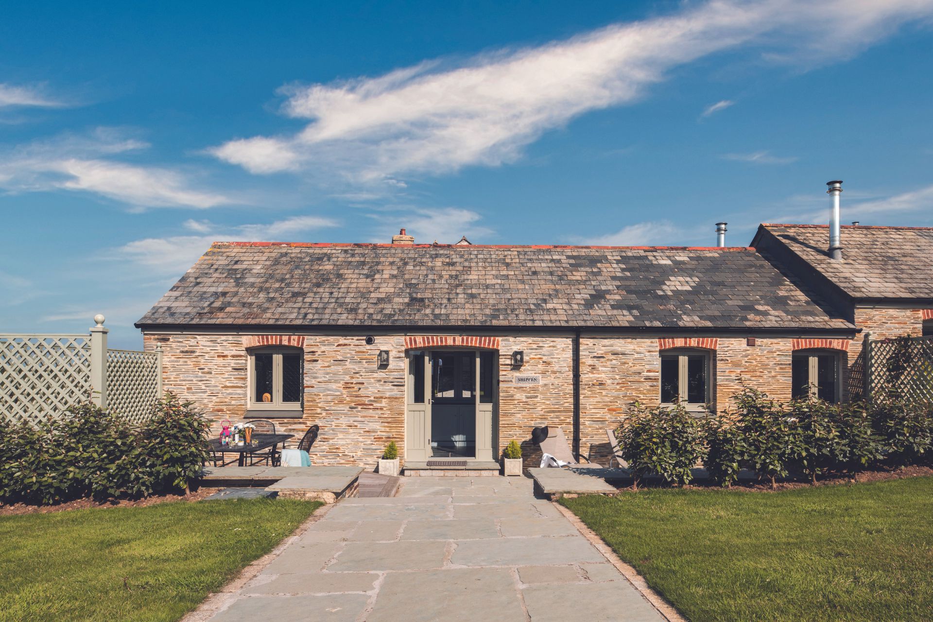 Farmhouse with large driveway