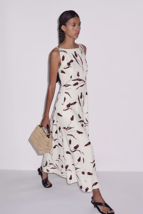 Woman in white and brown dress