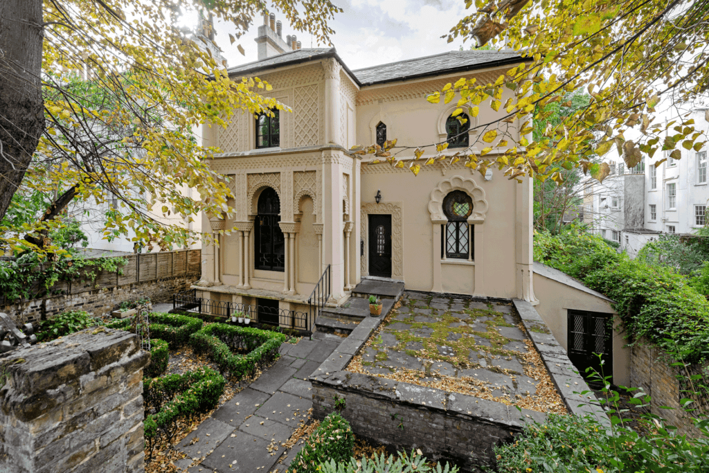 Villa in St John's Wood with an intricate facade and raised patio areas in front.