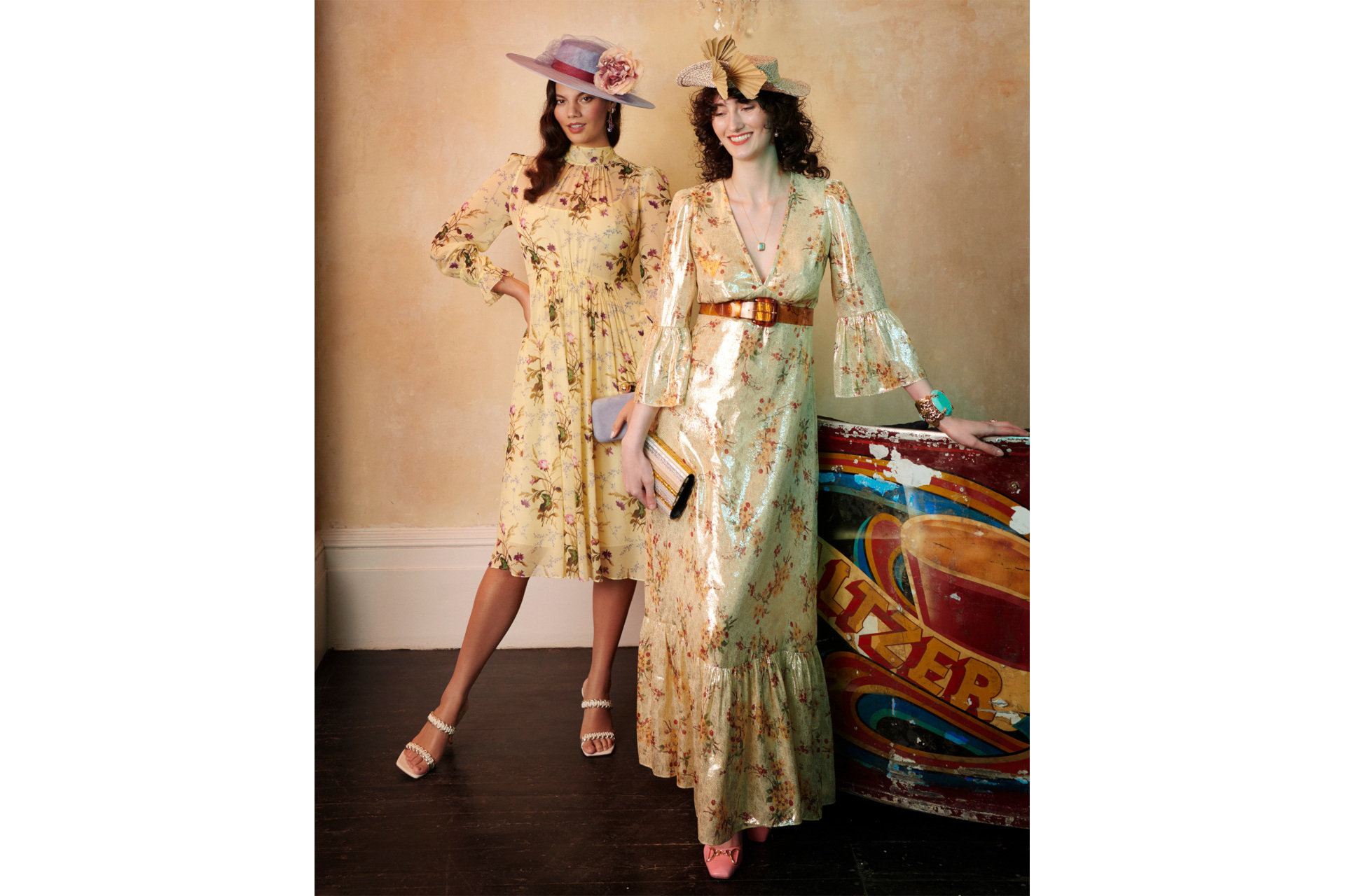 Two women in gold dresses