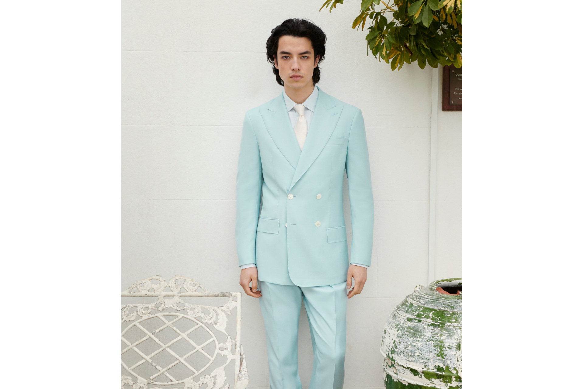 Man in light blue suit