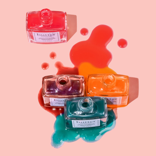 Overhead view of spilt bottles of varnish