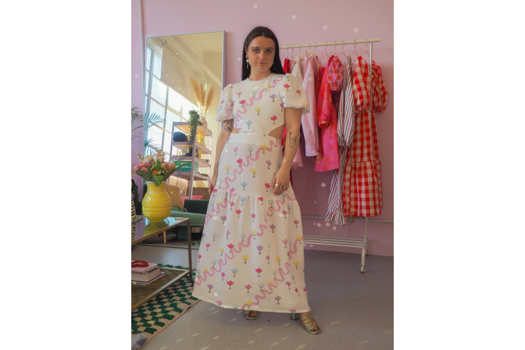 Woman in white dress with multicoloured flowers