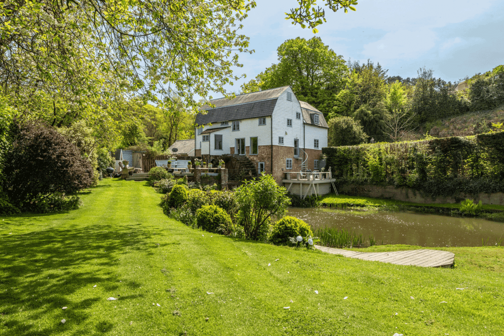 Mill house with lawns surrounding.