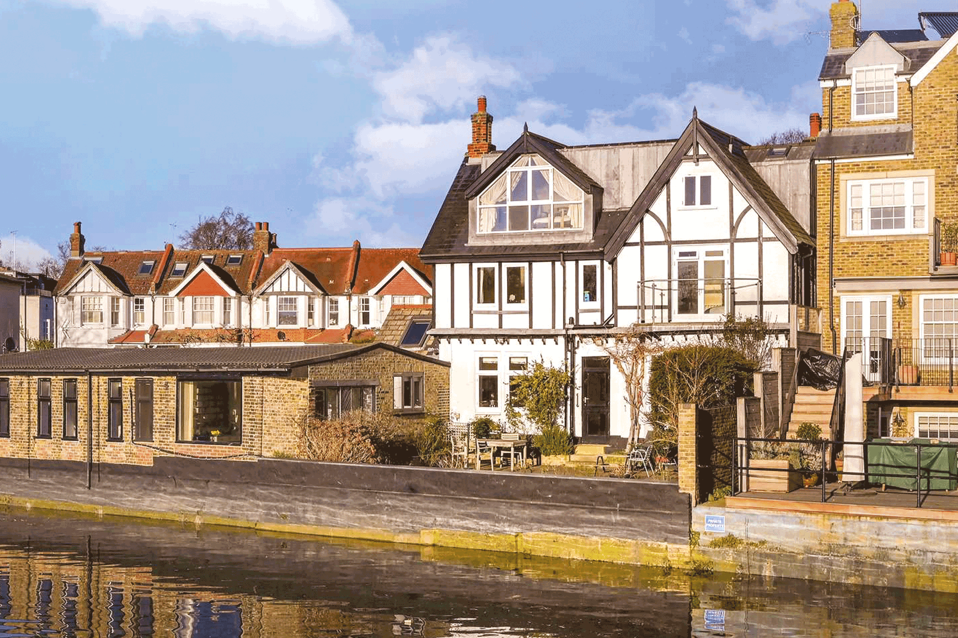 Gabled riverside house.