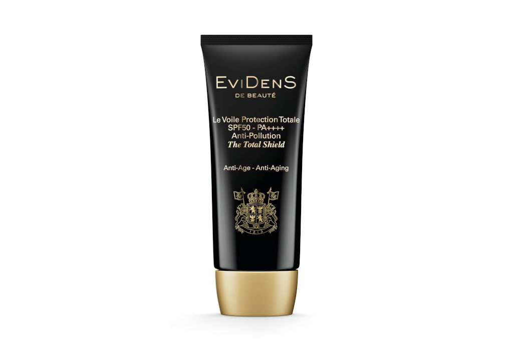 Black tube bottle with gold cap