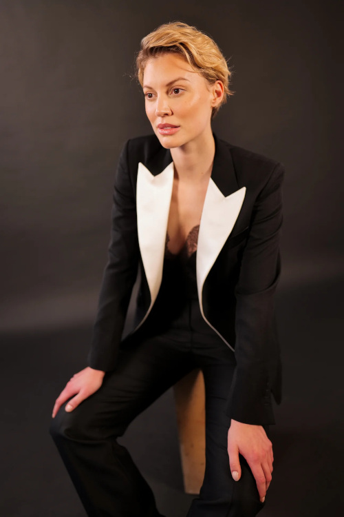 Woman in black tuxedo