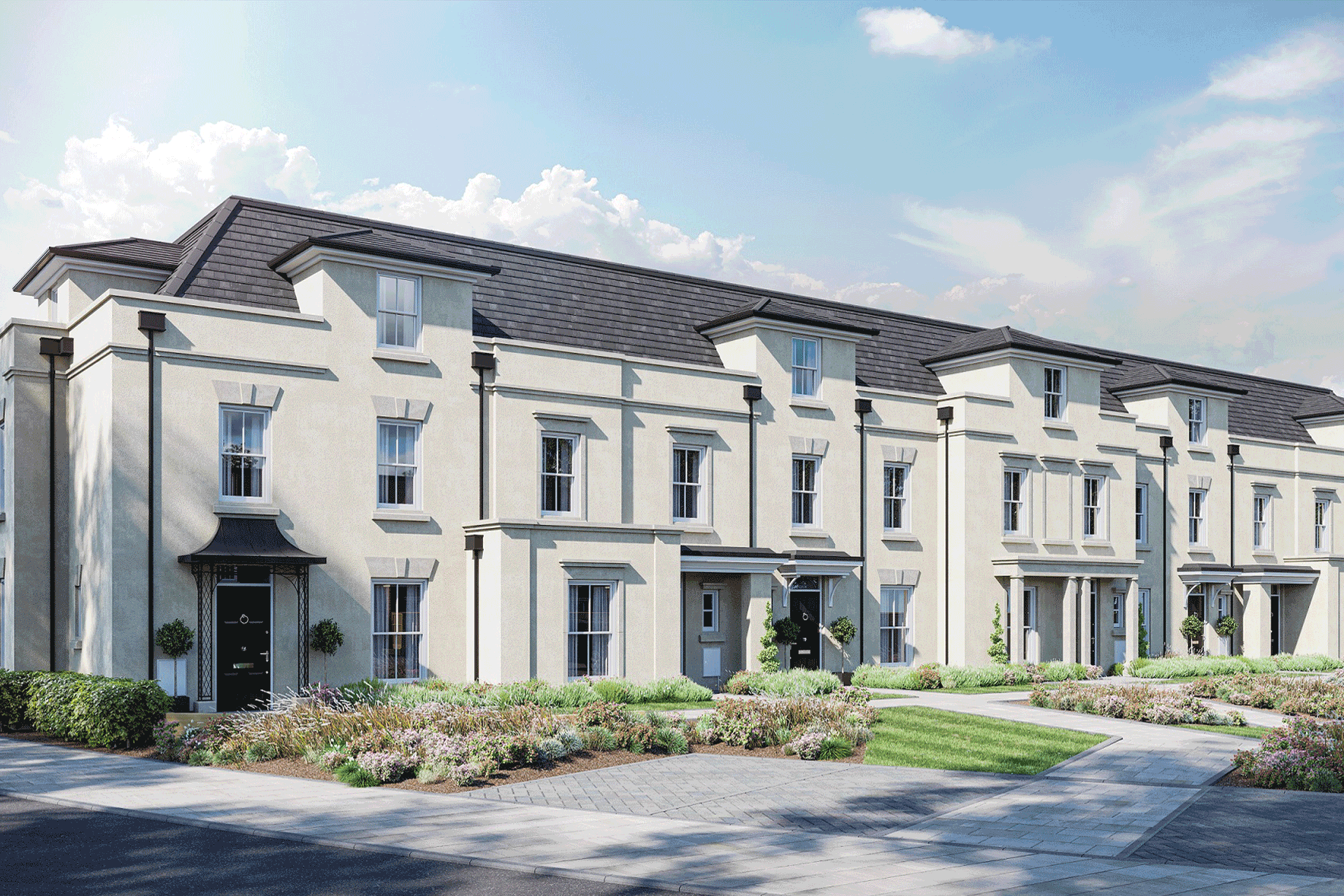 Large white apartment building with a grey slate roof.