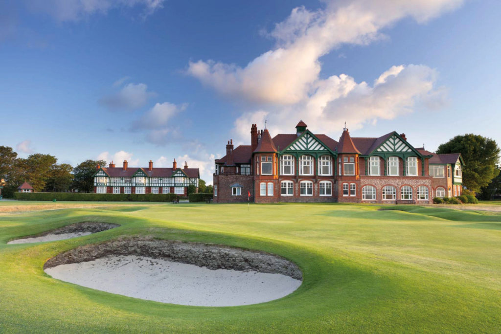 Golf course with stately hall in the background