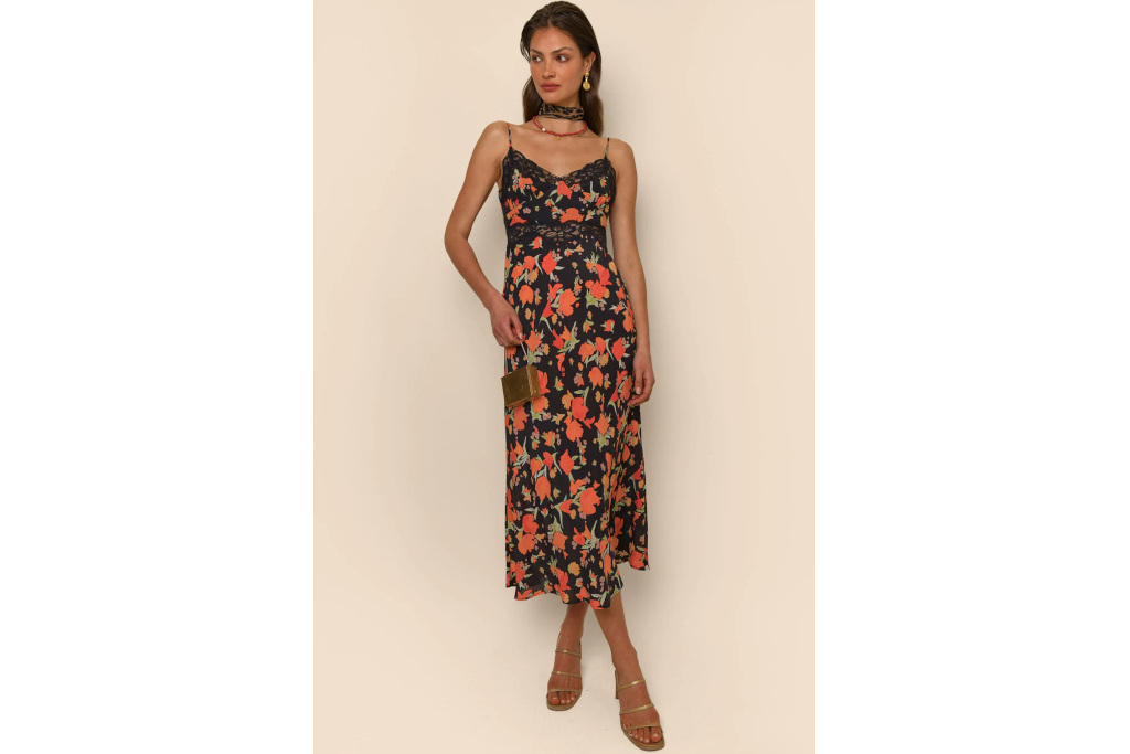 Woman in black dress with red flowers