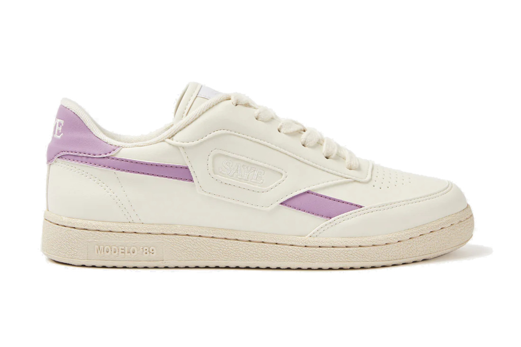 Cream trainers with purple stripe