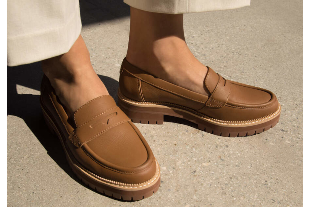 Close up of feet in brown loafers