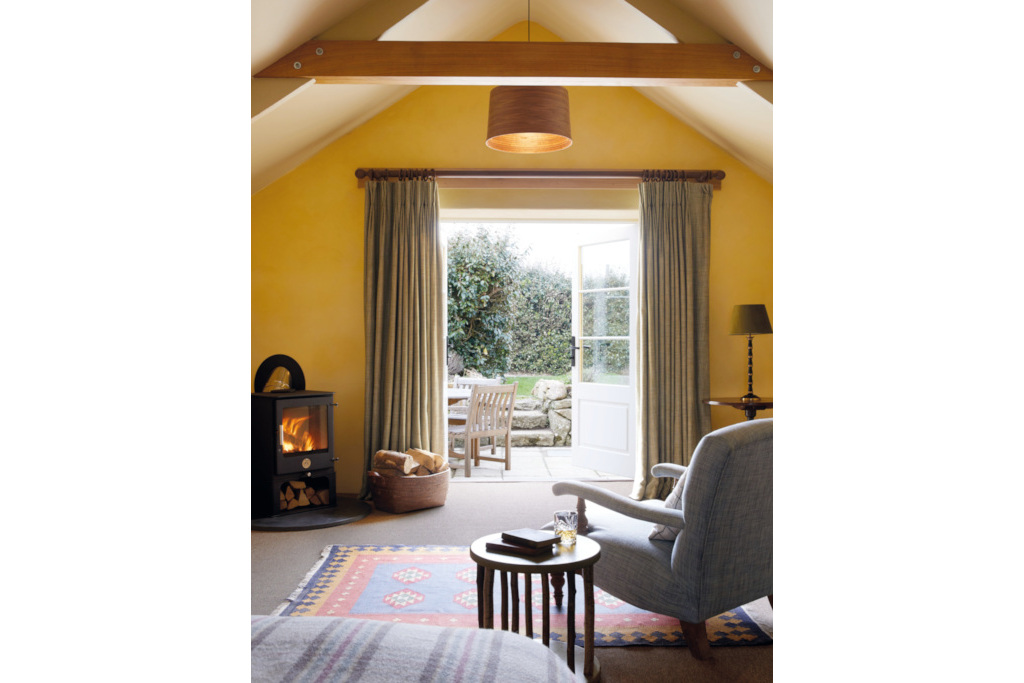 Living room with French doors leading to garden patio