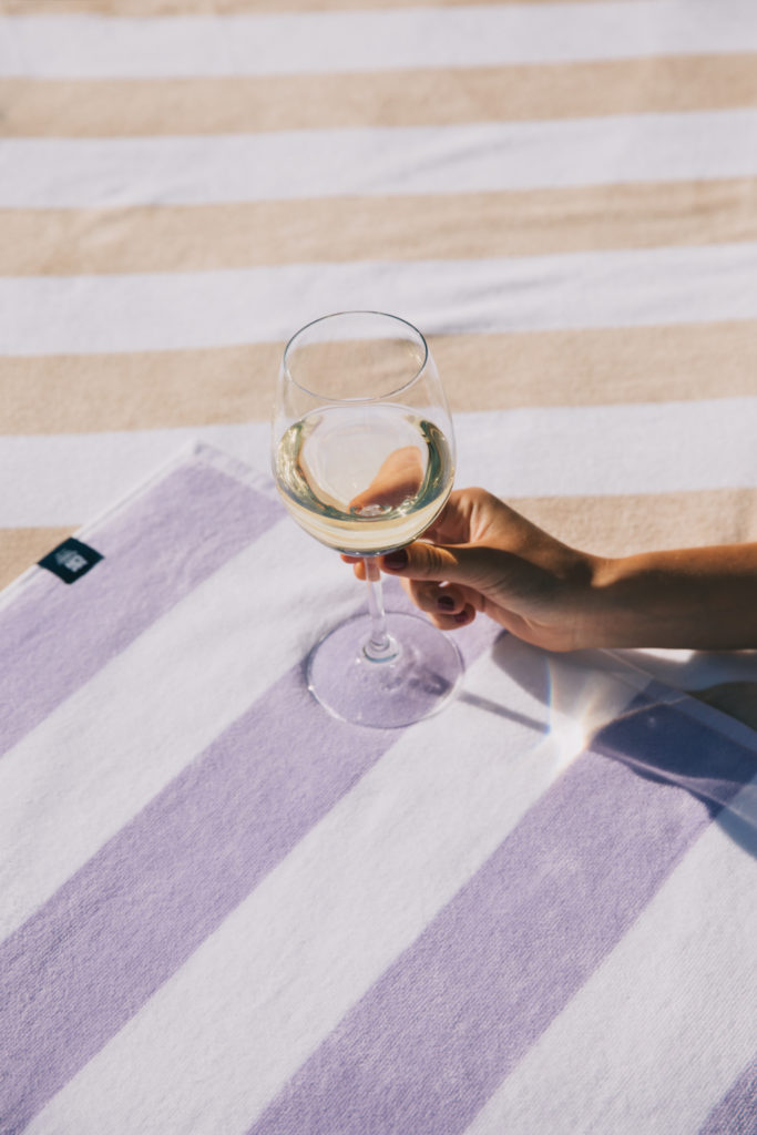Wine glass set on two towels