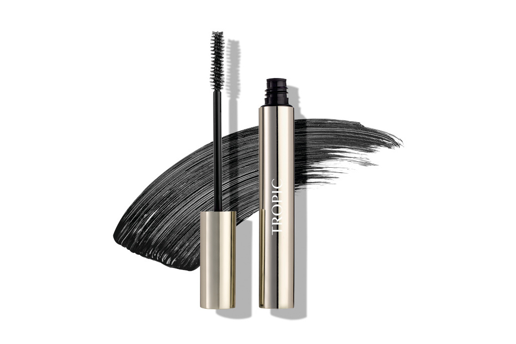 Mascara wand in front of spread product