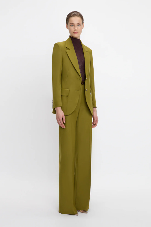 Woman in olive suit