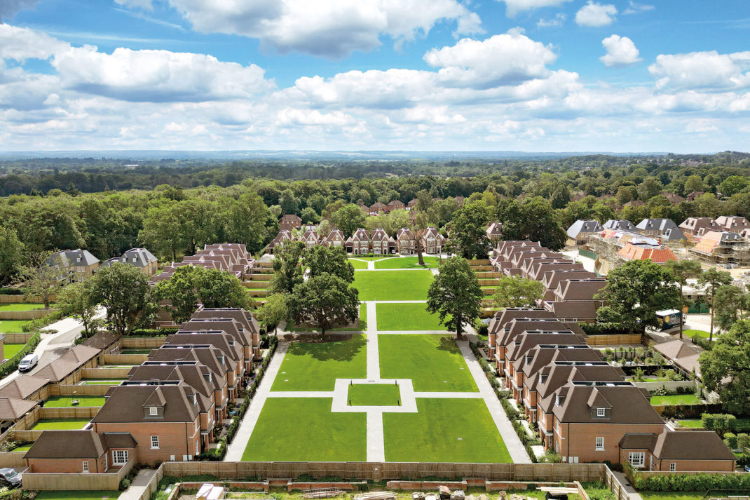 Two rows of houses surrounding a green space