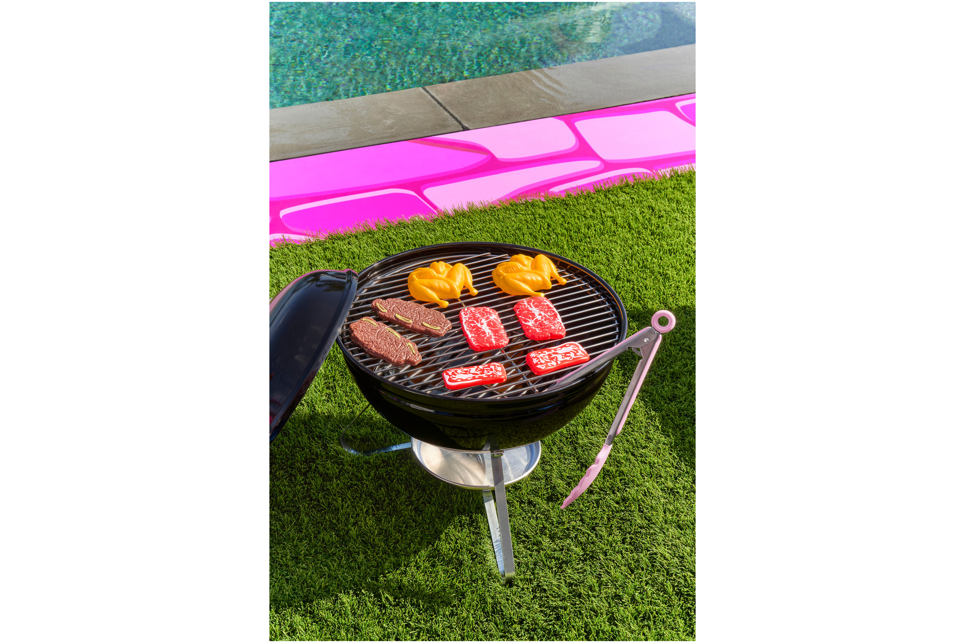 Plastic toy food on a BBQ