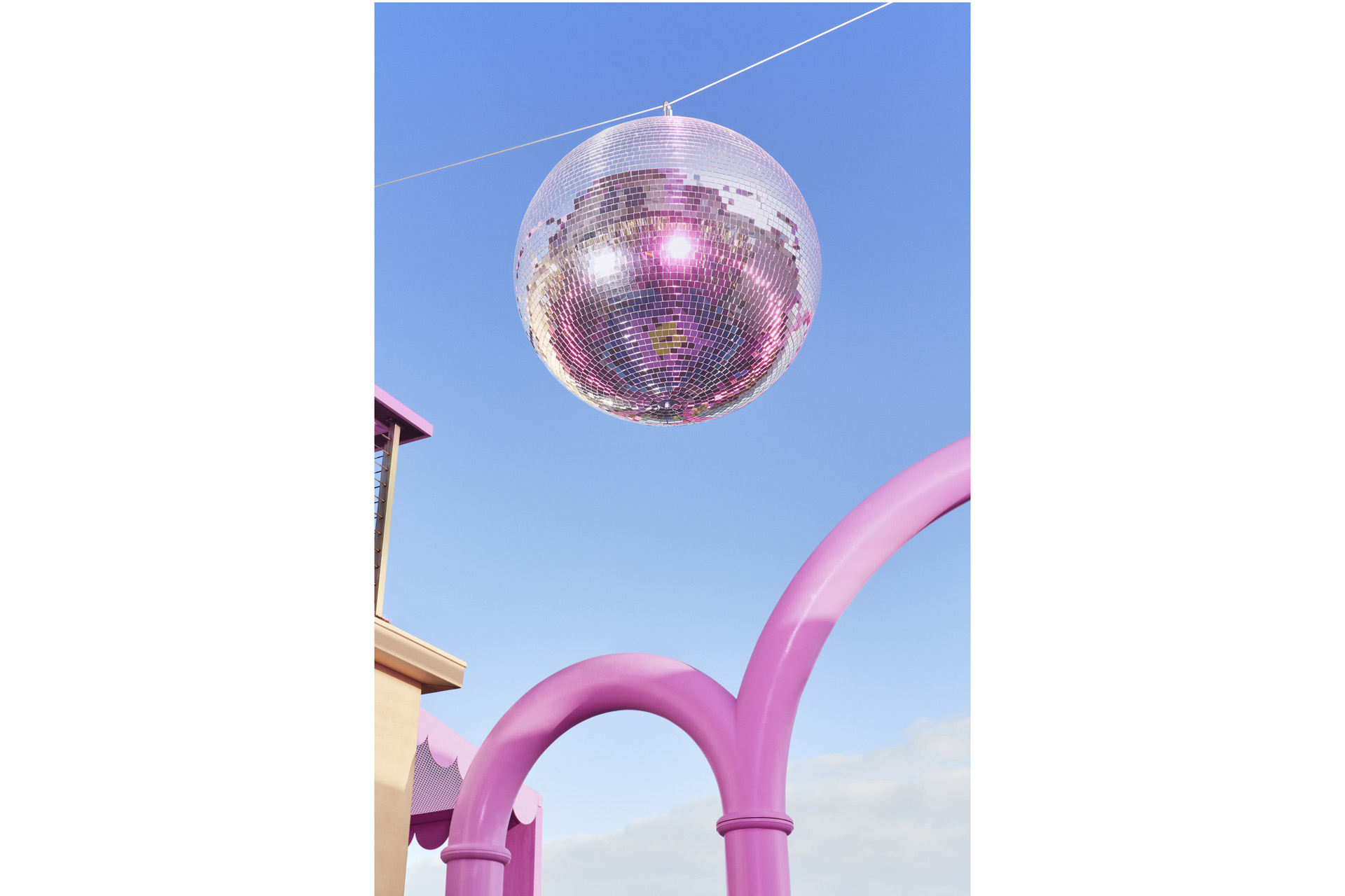 Disco ball against a blue sky