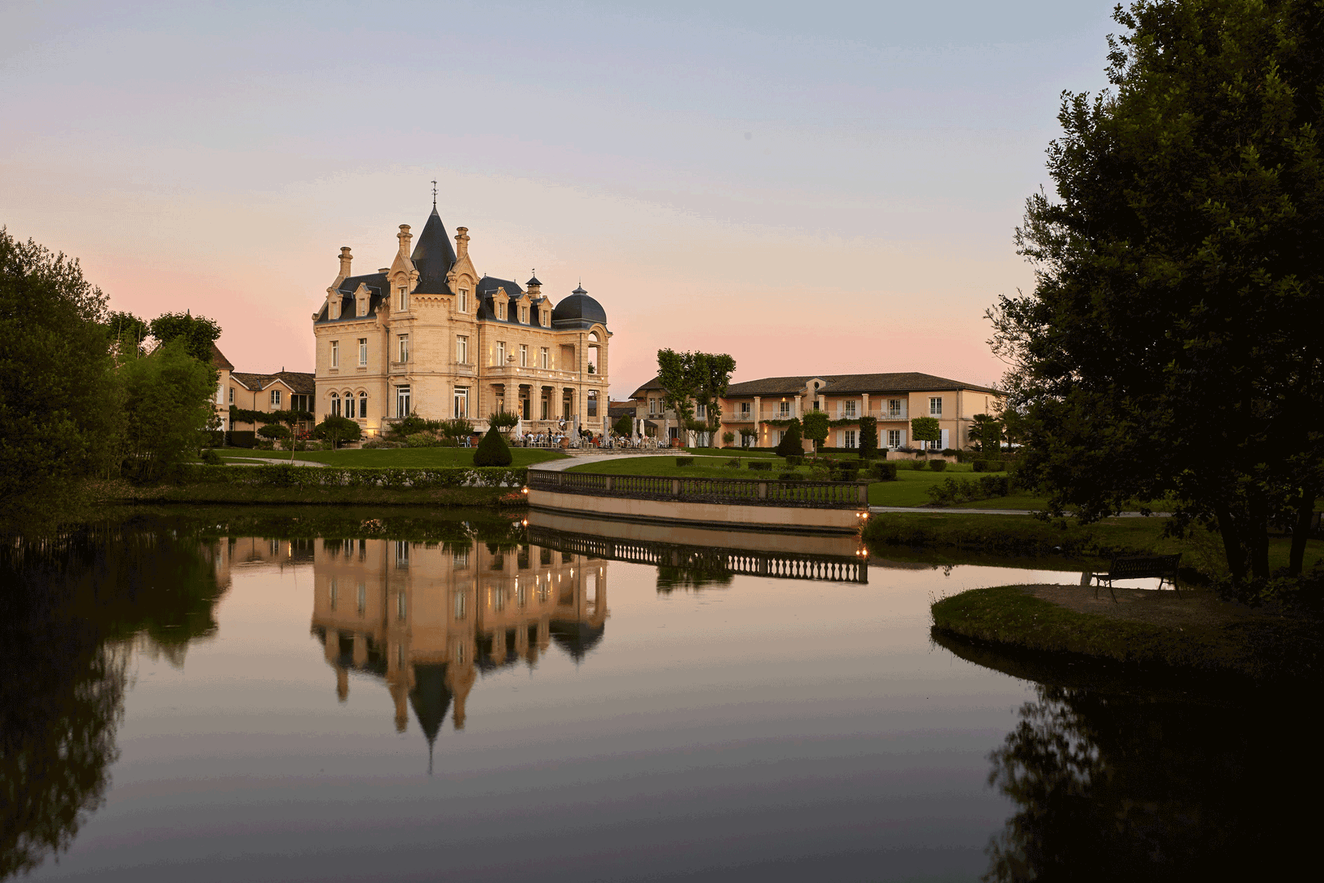 Château Hôtel Grand Barrail at dusk.