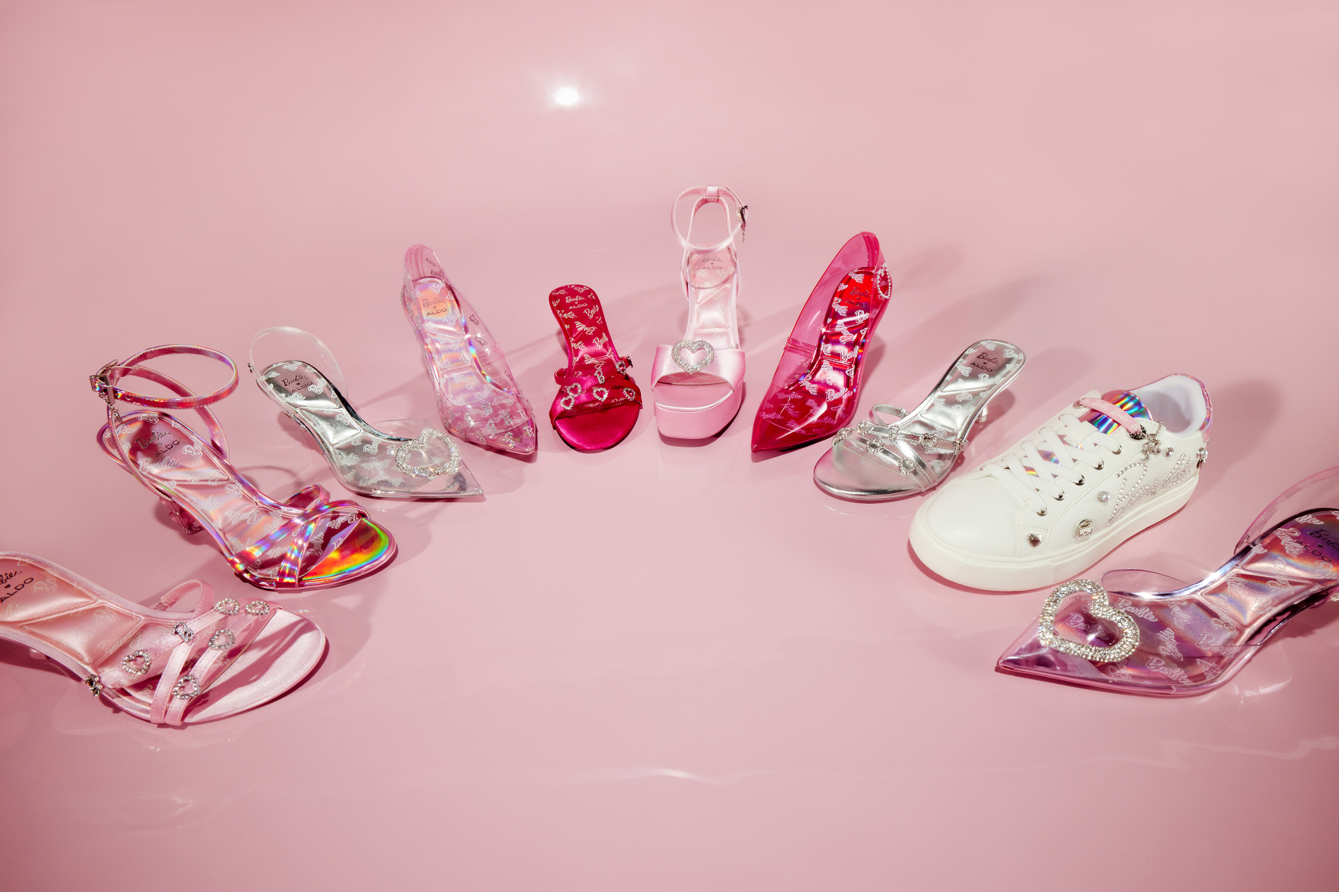 Shoes displayed in curve on pink background