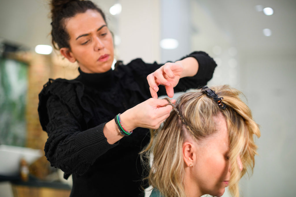 Afroditi Koutsouki braiding hair for the Face Lift Blowdry - Photo by Remo Knecht