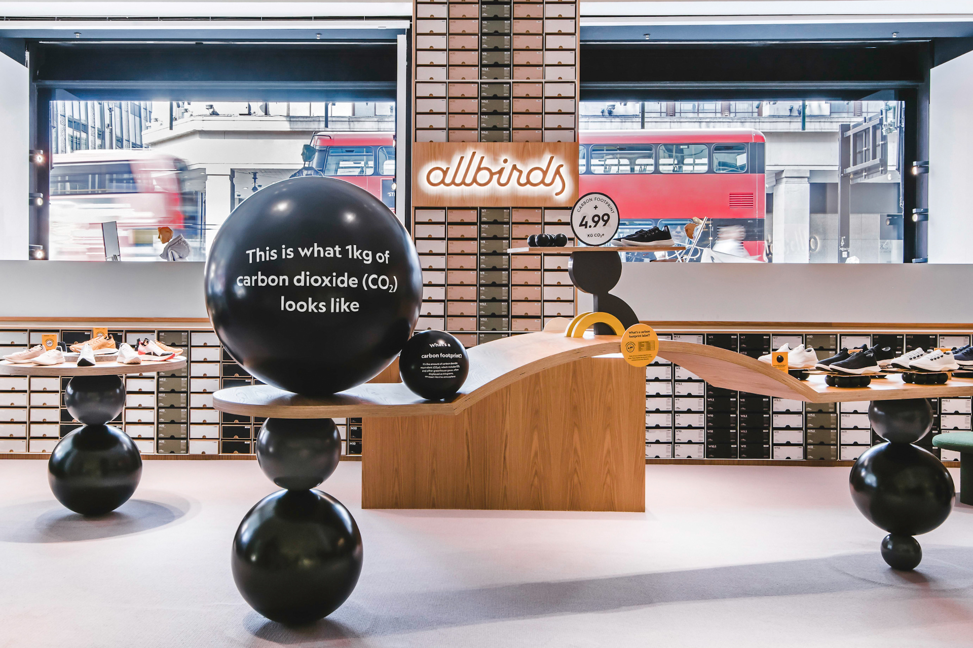 Shop layout with black ball sculptures and shoes