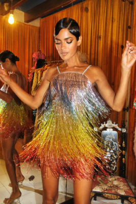 Woman in metallic rainbow fringe dress