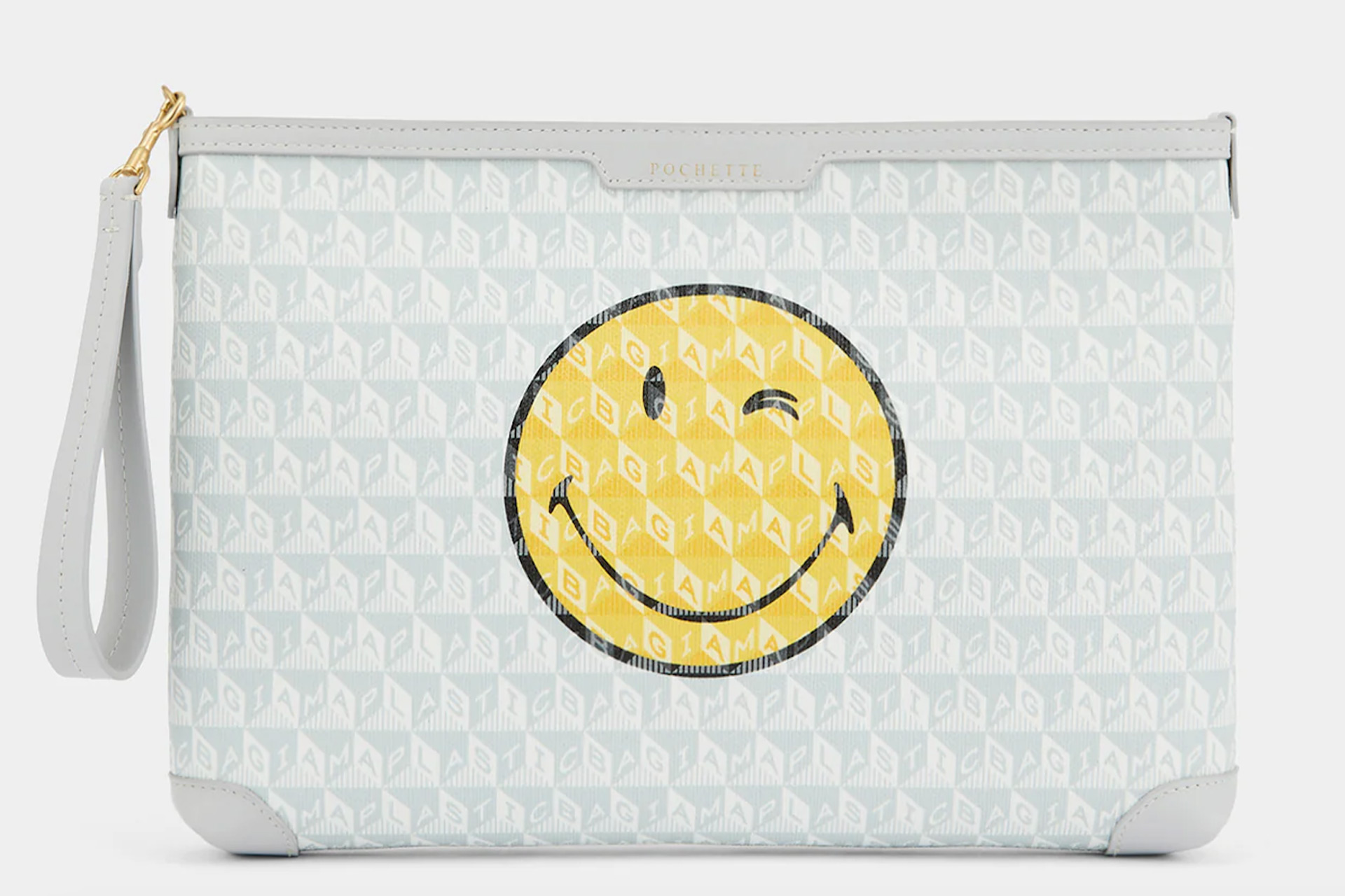 Anya Hindmarch envelope pouch with smiley face graphic.