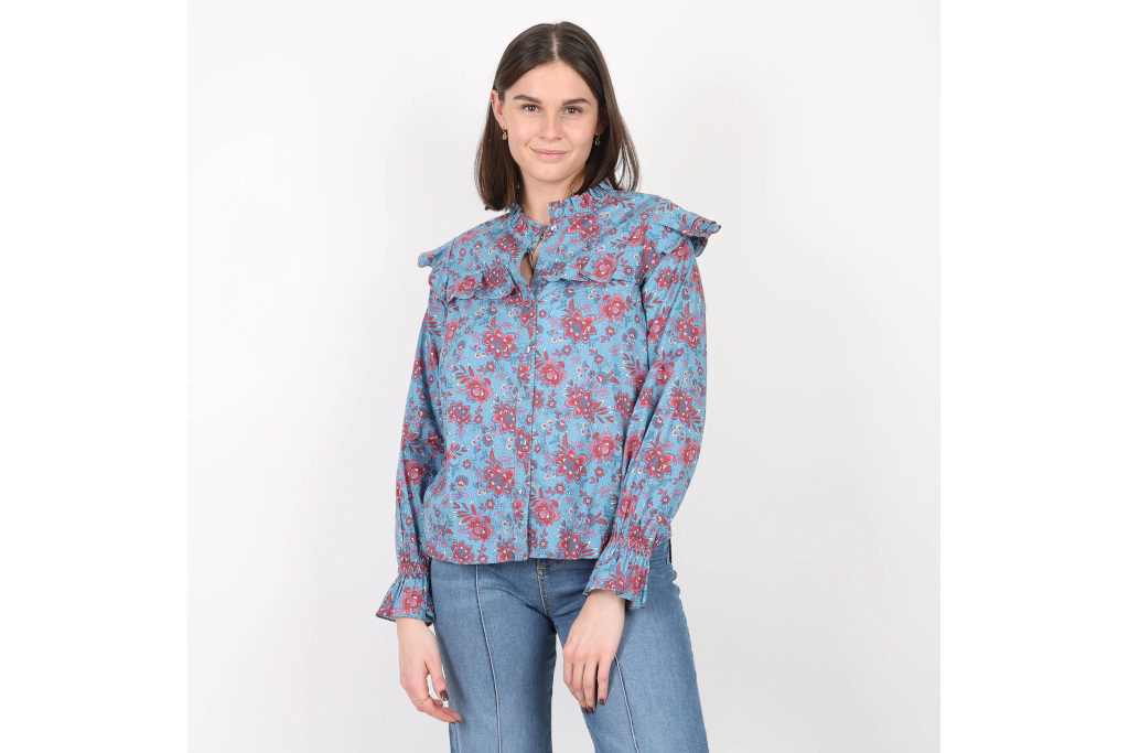 Woman in red and blue floral blouse