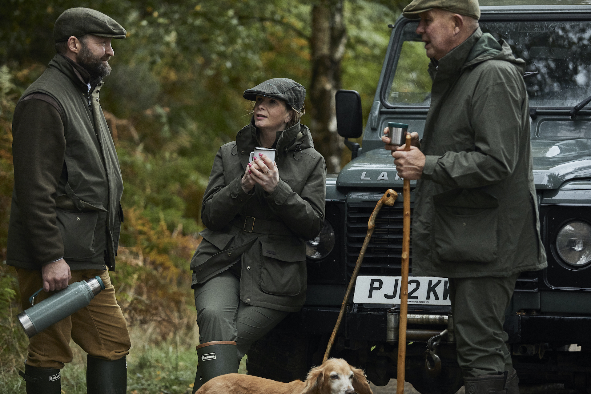 Two men and a woman wear the Barbour Country Active collection