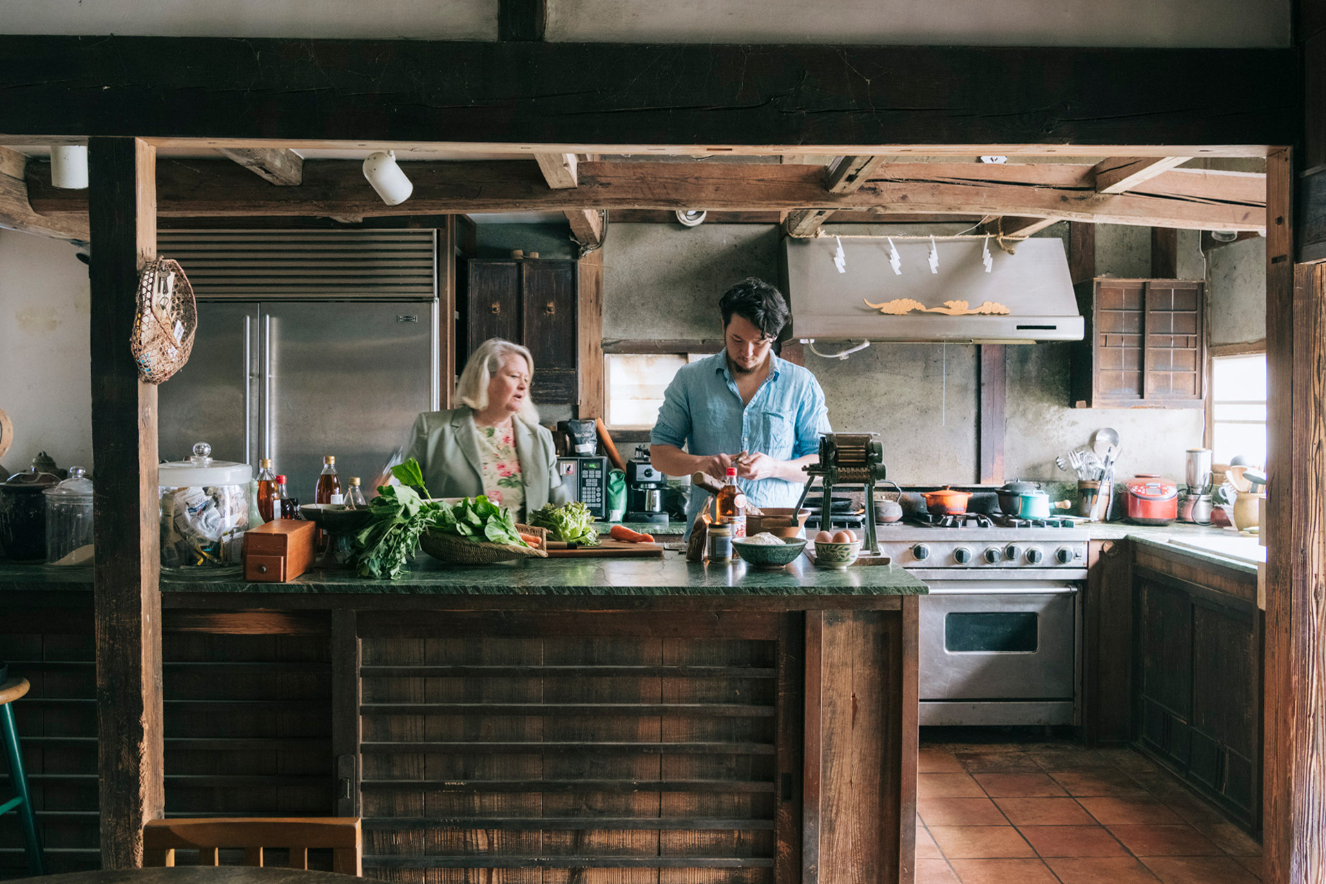 Nancy Singleton Hachisu and her husband in a kitchen